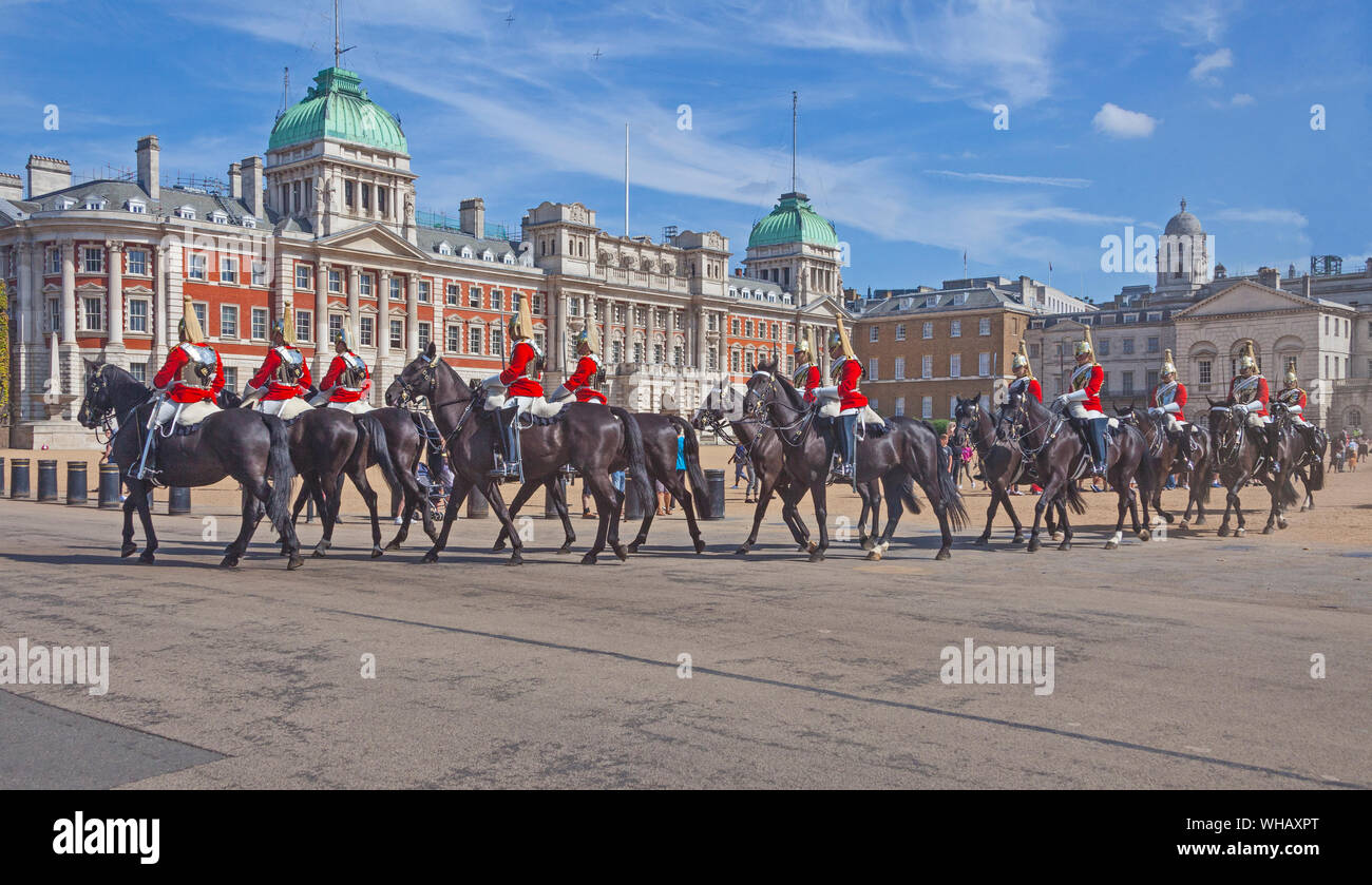 London, Westminster. A troop of Royal Life Guards leaving Horse Guards Parade following the Changing of the Guard ceremony. Stock Photo