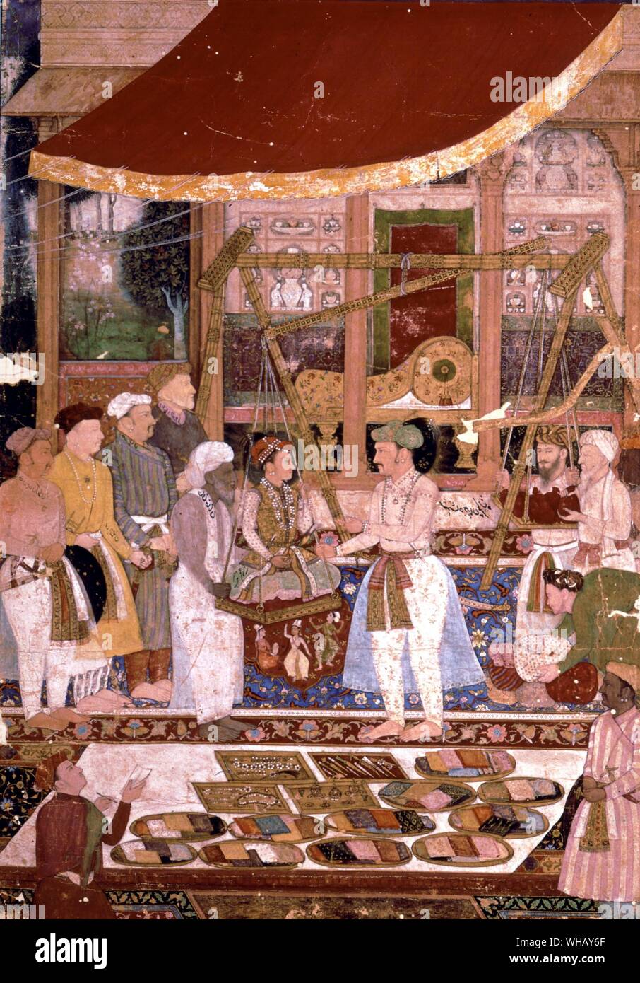 Emperor Tahangir weighing his son Prince Kurram, (the future Shah Jehan), in gold on his birthday, 1615. The Oriental Adventure by Timothy Severin, page 87. Stock Photo