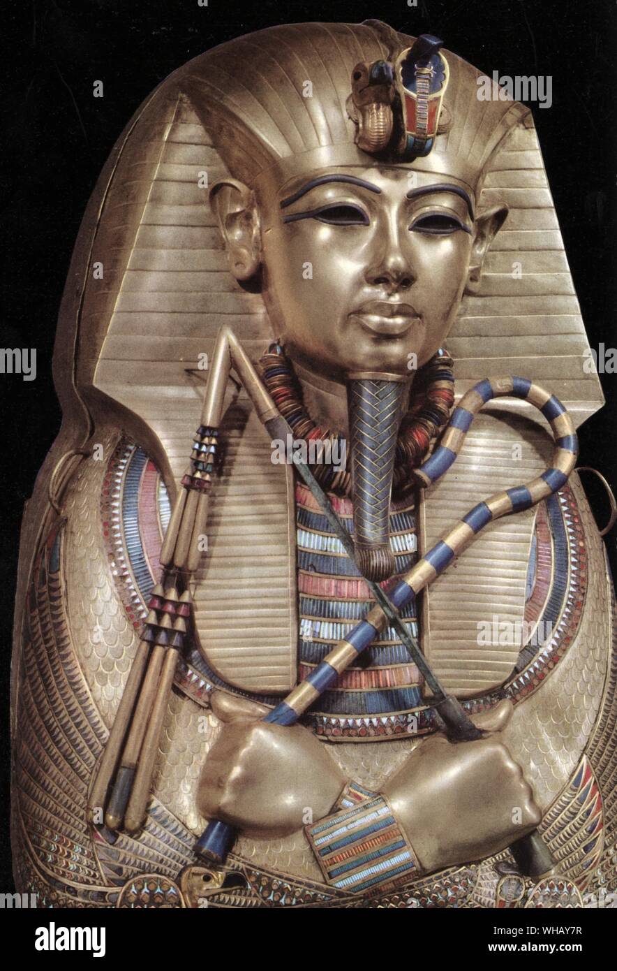 Detail of the second mummiform coffin. Gold plated wood inlaid with glass-paste. Tukankhamen, by Christiane Desroches Noblecourt, page 268.. The Egyptologist Howard Carter (employed by Lord Carnarvon) discovered Tutankhamun's tomb (since designated KV62) in The Valley of The Kings on November 4, 1922 near the entrance to the tomb of Ramses VI. Carter contacted his patron, and on November 26 of that year both men became the first people to enter Tutankhamun's tomb in over 3000 years. After many weeks of careful excavation, on February 16, 1923 Carter opened the inner chamber and first saw the Stock Photo