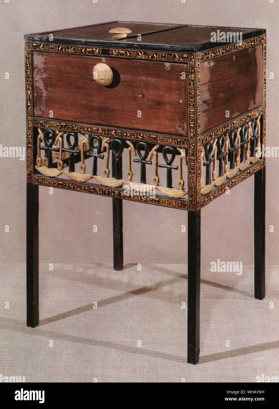 A cabinet with legs, ancestor of the modern commode. Cedarwood and gilded ebony, decorated with hieroglyphic symbols ensuring divine life. Tukankhamen, by Christiane Desroches Noblecourt, page 234. Stock Photo