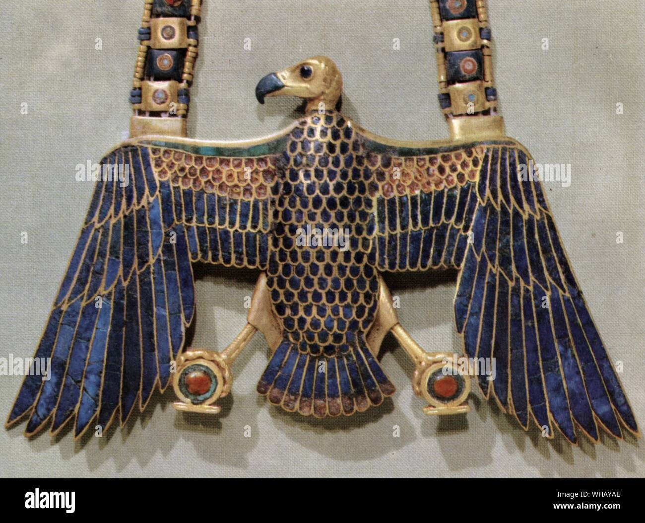 The king's pendant in gold cloisonne depicting the vulture (Nekhabet) goddess of the South Nekhabet, Upper Egypt. Tukankhamen, by Christiane Desroches Noblecourt, page 177.. Nekheb (the modern el-Kâb, a few miles north of Edfu) was the capital of the Southern Kingdom. the vulture-goddess, Nekhabet, was its protecting deity. But at both capitals the hawk-god, Horus, was worshipped as the distinctive patron-deity of both kings.. The vulture was the symbol of Upper Egypt. Pharaohs wore the uraeus (cobra) and the head of a vulture on their foreheads as symbols of royal protection. The goddess Stock Photo