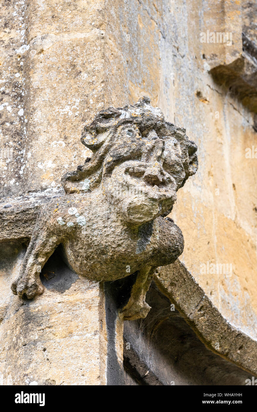 Medieval gargoyle on St Peters church (1465) in the Cotswold town of Winchcombe, Gloucestershire UK Stock Photo
