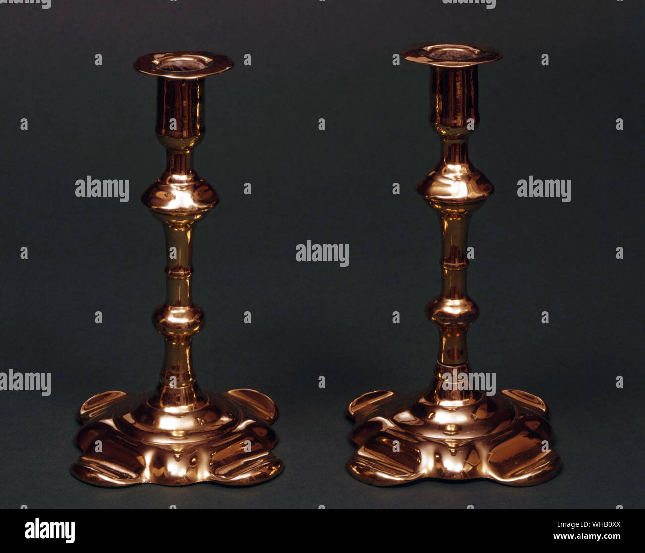 Pair of brass candlesticks by George Grove, English, mid-18th century.. Victoria & Albert Museum, London. Stock Photo