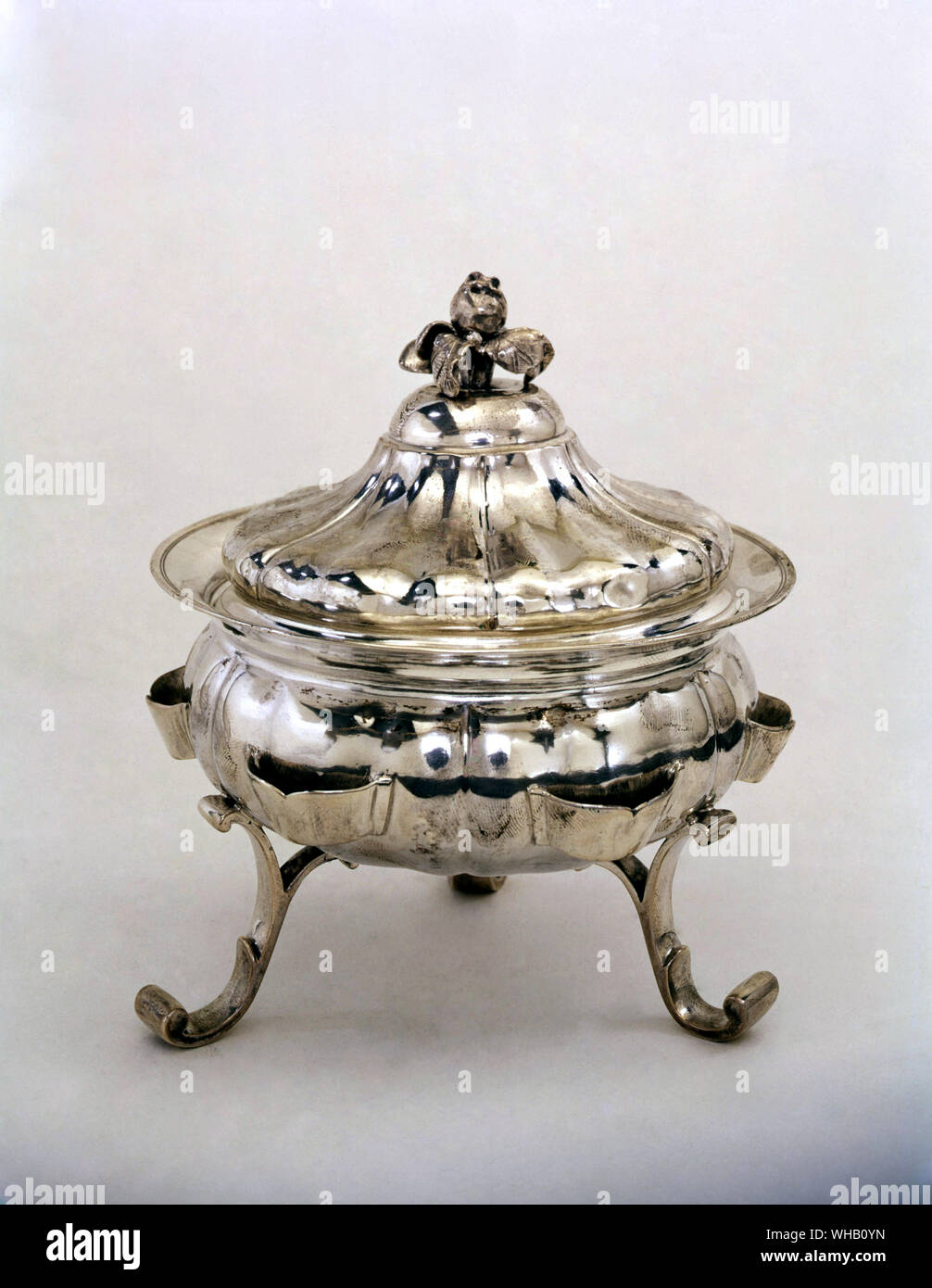 Bowl and cover on three scroll feet, 18th century silver.. Victoria & Albert Museum, London. Stock Photo