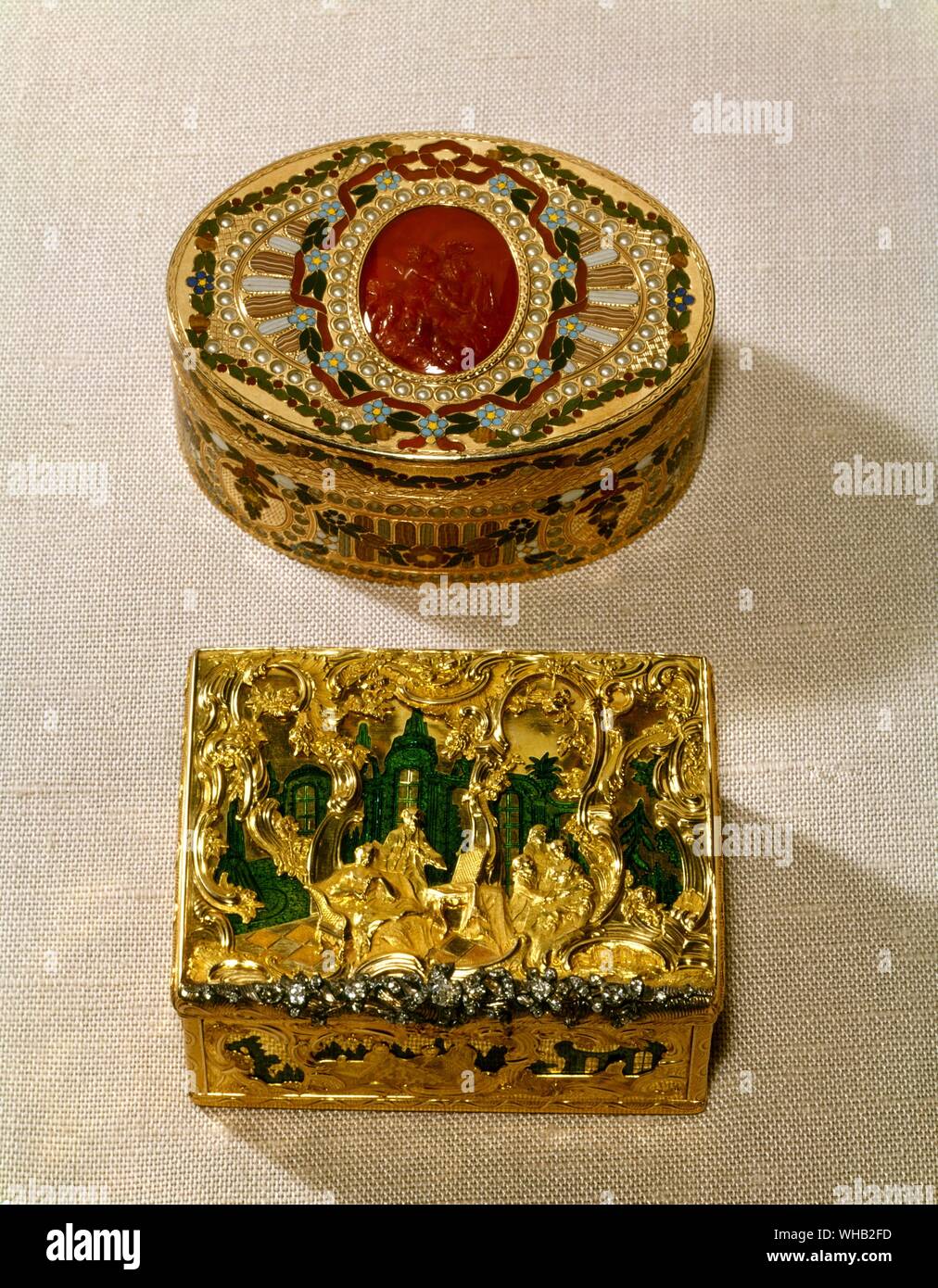 Snuff boxes. Gold, inlaid with various stones and similated pearls. in the centre of the lid a red cornelian cameo with amorini. Probably by J.C Neuber of Dresden second half of the 18th century. Stock Photo