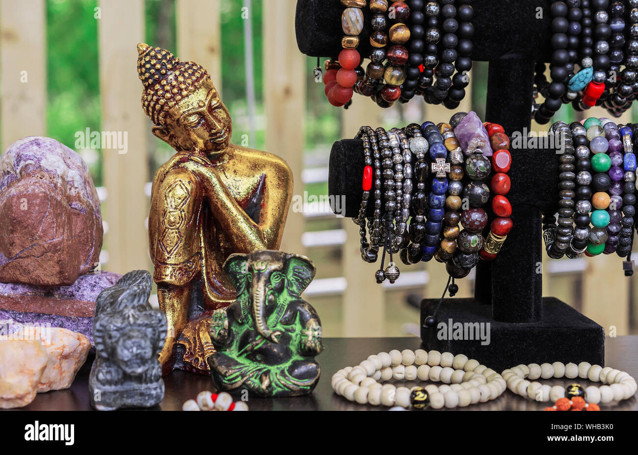 Buddha statuette in a street souvenir shop. Indian souvenir statuettes and handicrafts. Stock Photo
