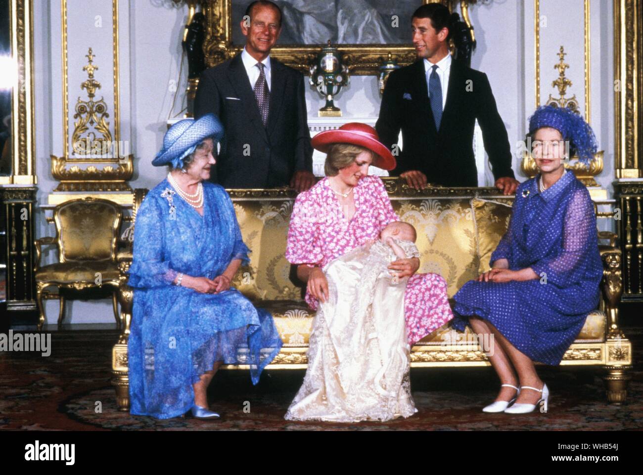 Christening of first son, William, of Prince Charles and Diana, Princess of Wales (Lady Diana Spencer) 4 August 1982 at Buckingham Palace. Diana is flanked by Queen Elizabeth the Queen Mother (grandmother to Prince Charles and mother to Queen Elizabeth II) and Queen Elizabeth II (mother of Prince Charles and mother-in-law to Diana). In the photo behind are PrincePhilip the Duke of Edinburgh, and Prince Charles, the Prince of Wales.. Stock Photo
