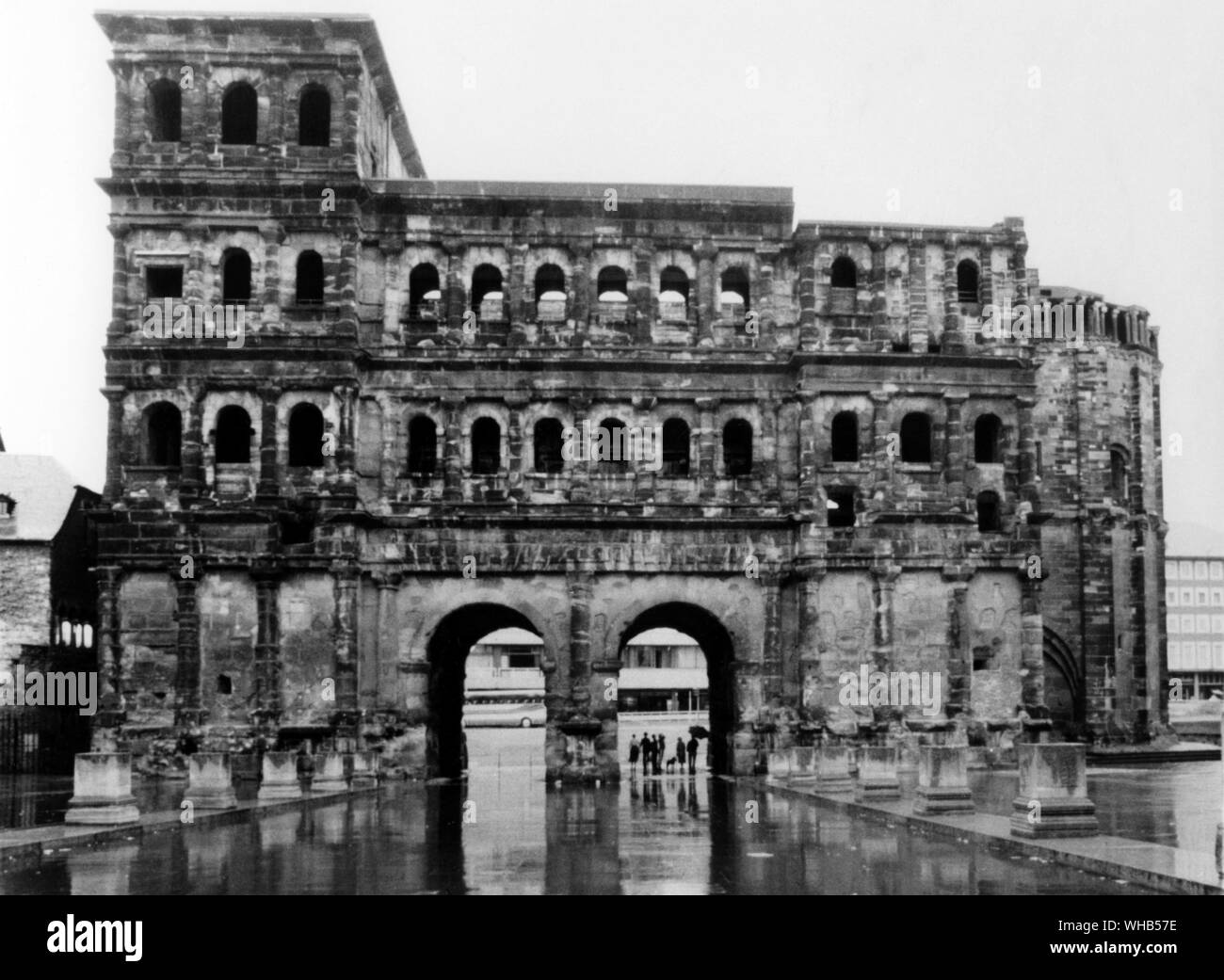 Porta Nigra is a city gate, part of the Roman architecture in Trier, west Germany. Viewed from the Town side, from the north. Built from grey sandstone between 180 and 200 AD.. . . Stock Photo