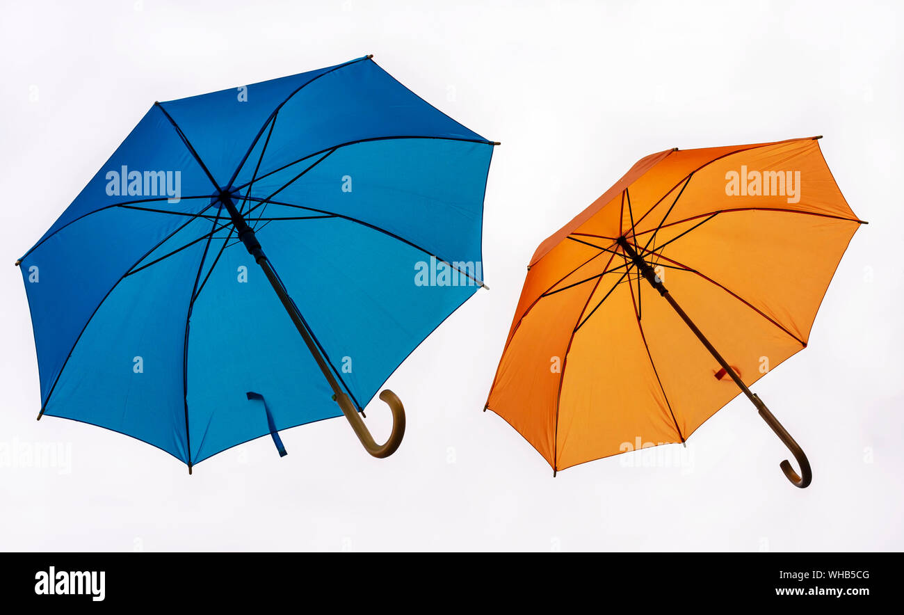 Two colorful umbrellas on a white background. Stock Photo