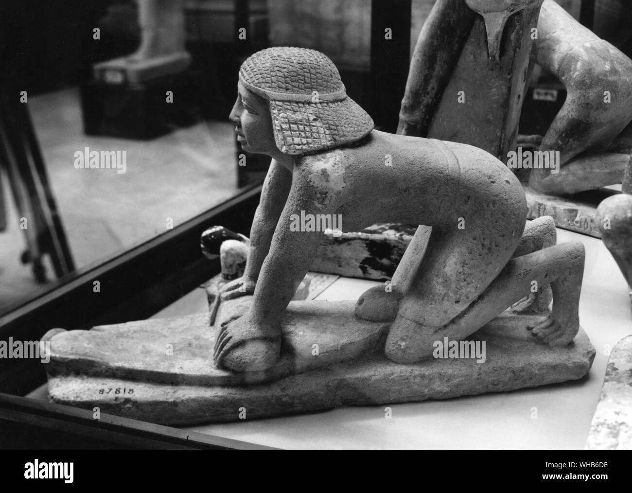 Girl grinding corn Egyptian Pharoahs Dynasty VI Old Kingdom. Stock Photo