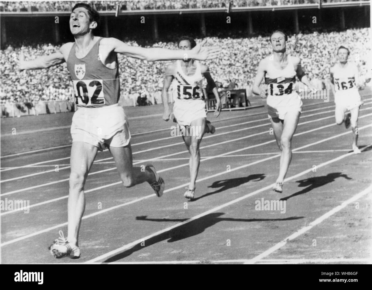 Aus., Melbourne, Olympics, 1956: Ron Delaney of Ireland wins the Olympic 1,500 metre race at Melbourne in a new Olympic Record time of 3:41.2 . Silver medal went to Walter Richtzenhain of Germany () and the bronze to John Landy (). . . . Stock Photo