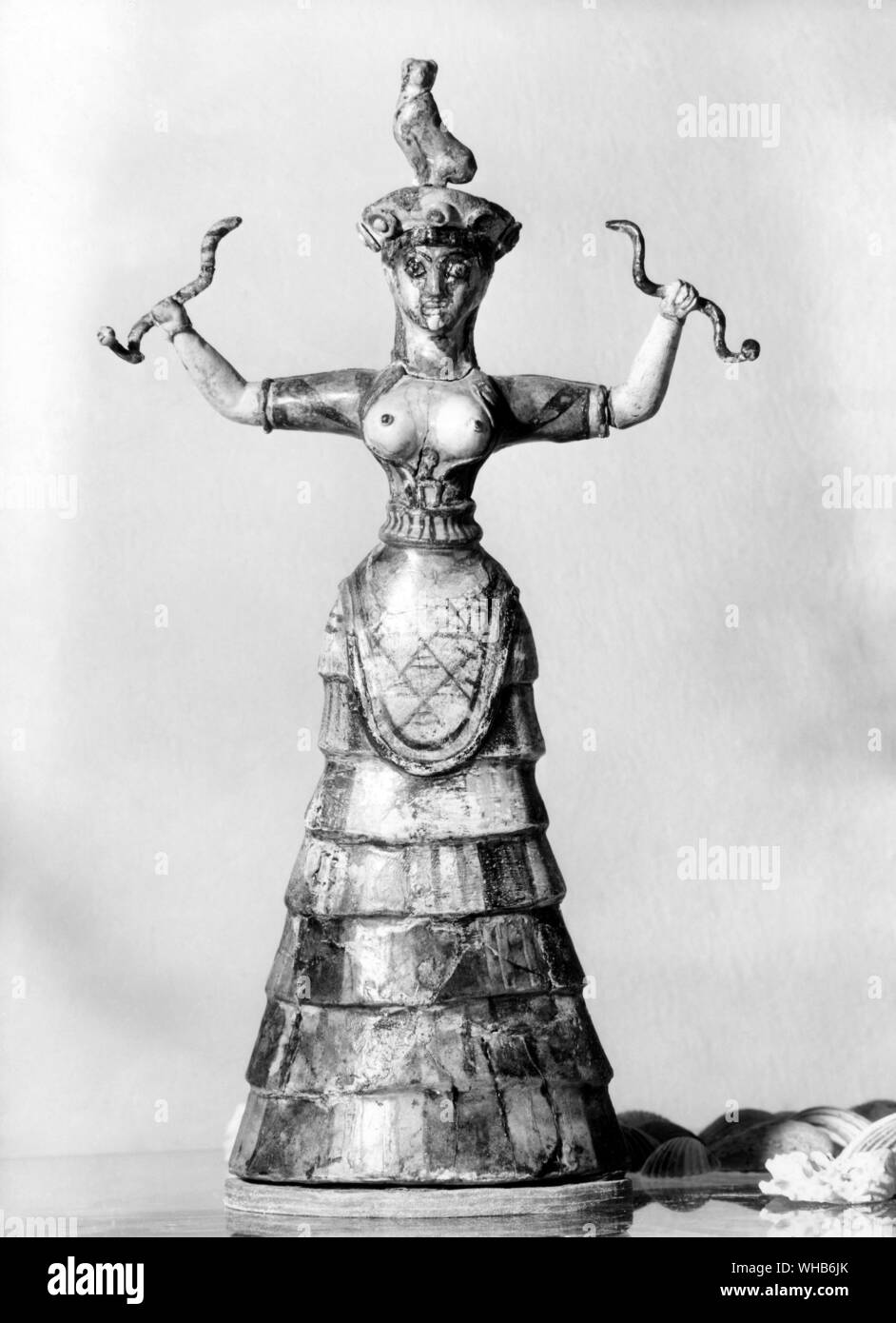 Snake-priestess, or a snake-goddess, from Palace of Minos at Knossos - Crete. Minoan Snake Goddess figurine c 1600 BCE. Stock Photo