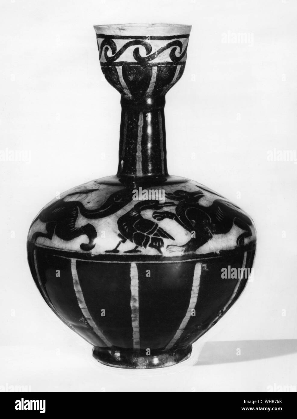 A bottle with black slip under turquoise glaze, probably Ravy, 12th Century.. Persian Pottery Stock Photo