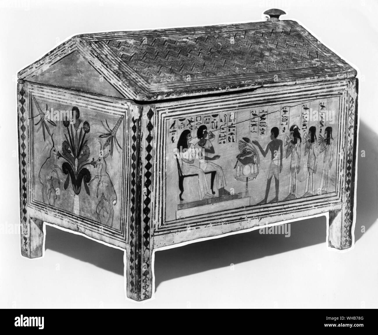 Propitiation of evil powers and spirits of the dead. . Among the powers who must be respected are the spirits of the dead because they can still affect the living for good or ill Porpa a royal official and his wife are shown in the after life receiving gifts of food from their living children. Egyptian wooden box 280BC Stock Photo