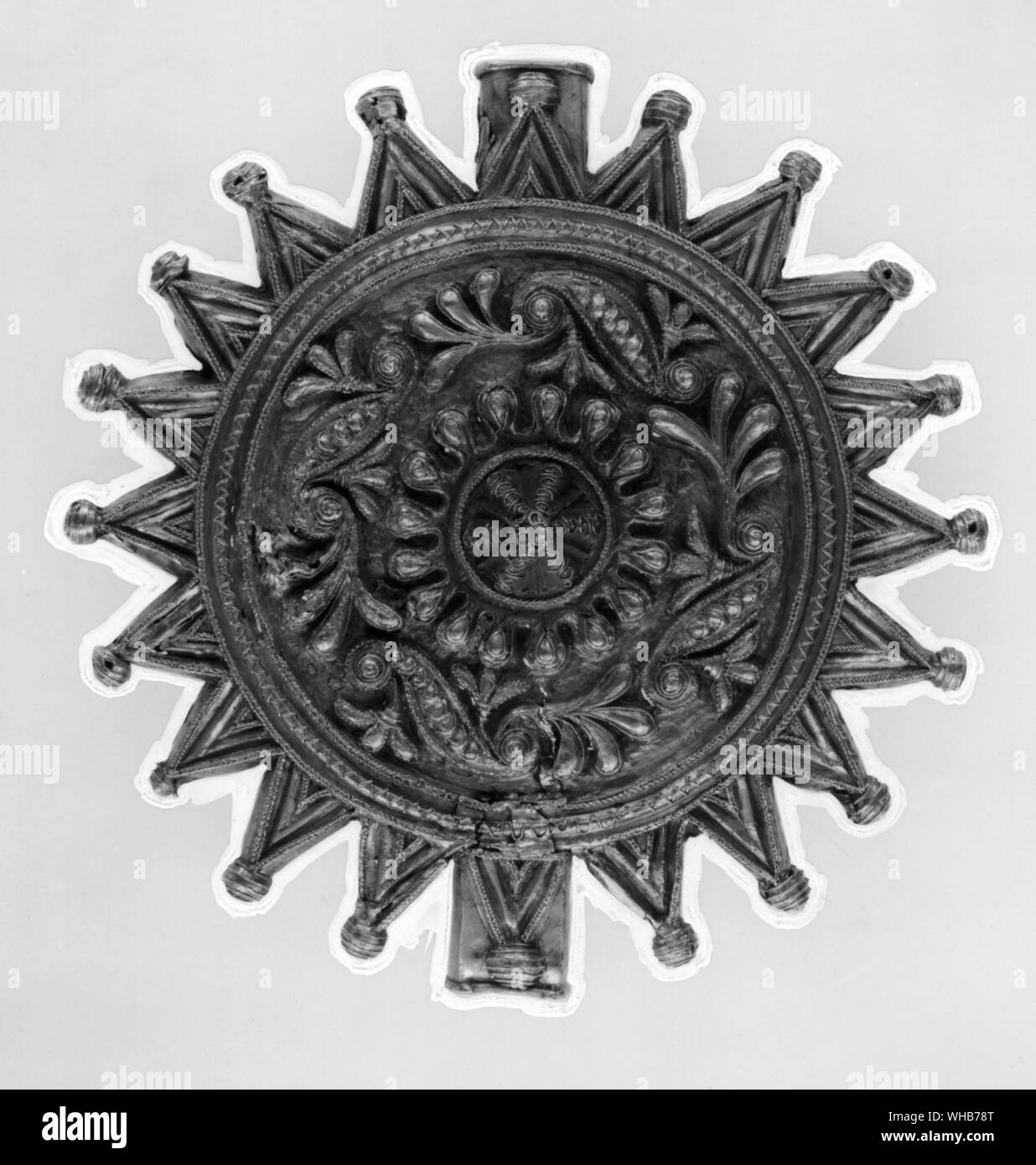 Gold pectoral disk worn by the Ashanti kings 19th century. . Such disks were worn by young male servants of the Ashanti kings. These servants, known as souls, preceded the king on all ceremonial occasions to ward off evil. The disks are often called soul washers' badges Stock Photo