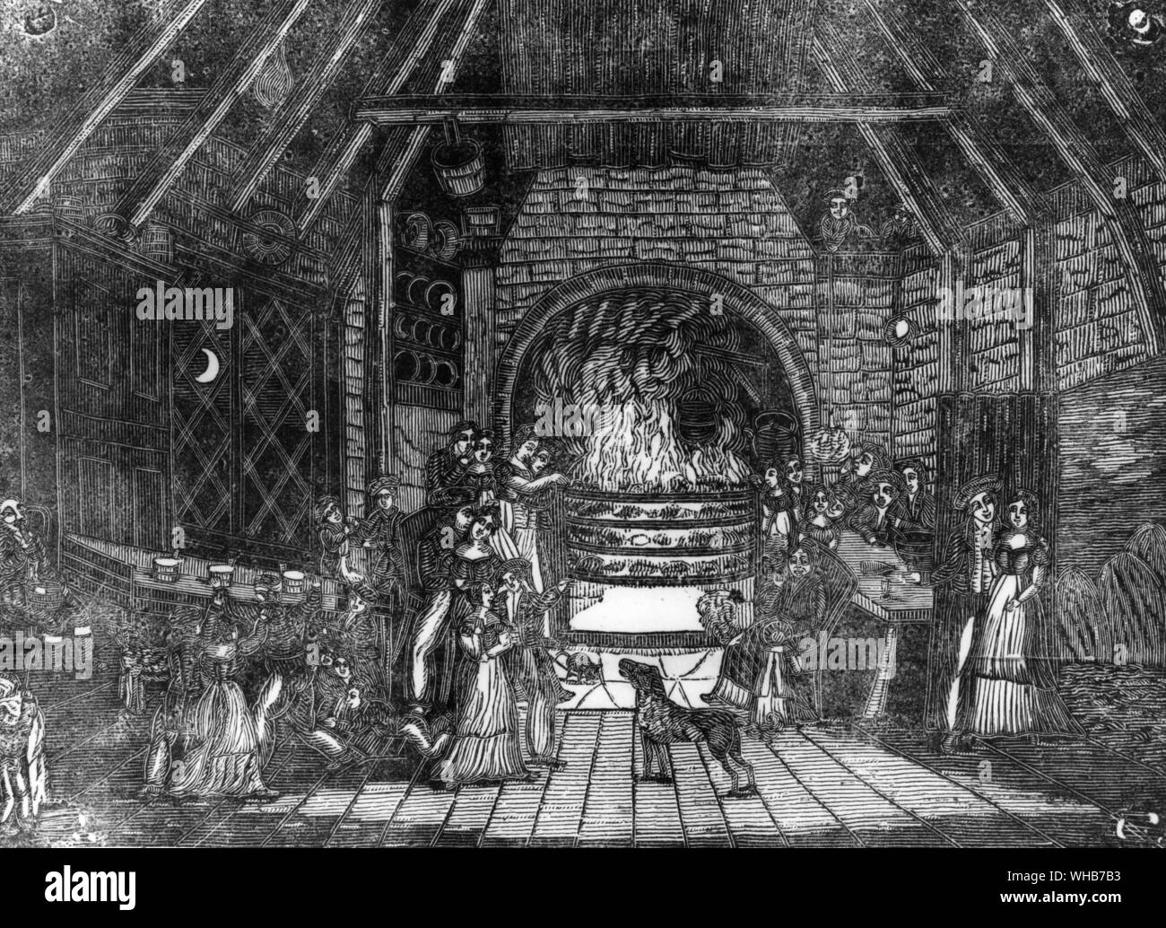 Halloween people sitting around a fire. While the fairies are abroad humans stay inside around the fire. broadsheet of 1795 Burns' publication Stock Photo