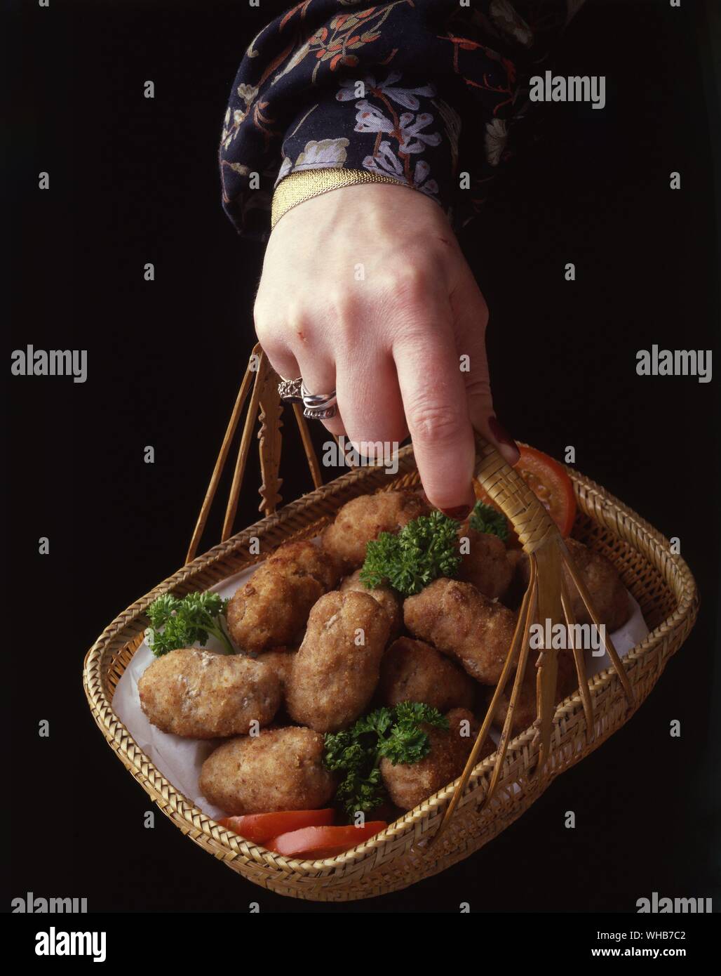 Chicken in a basket ?. Scampi in a basket ?. Stock Photo