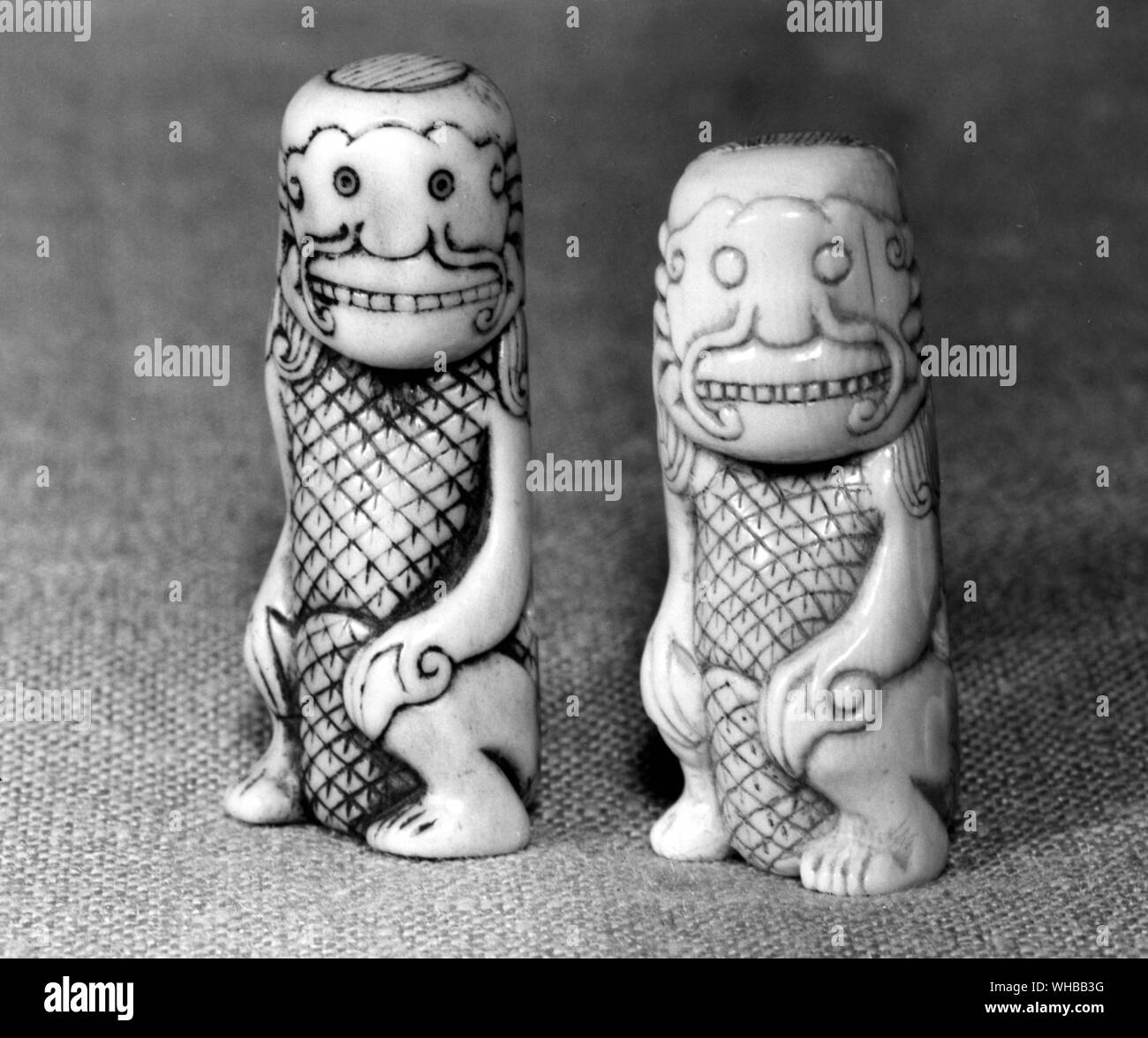 Asian artifacts : right - Netsuke in staghorn based on a Malay Keris handle 18th Century . left - copy in ivory by Patrick Woodford. W W Winkworth Collection. Stock Photo