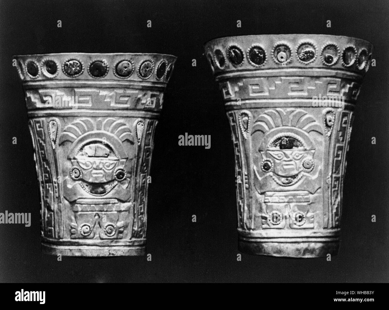Two beakers with turquoise inlay , Chimu culture , Peru , South America .12th or 13th Century . Heights 7 1/4 inches or 19 cm and 8 5/8 inches or 22 cm. The Mujica Gallo Collection , Lima Stock Photo