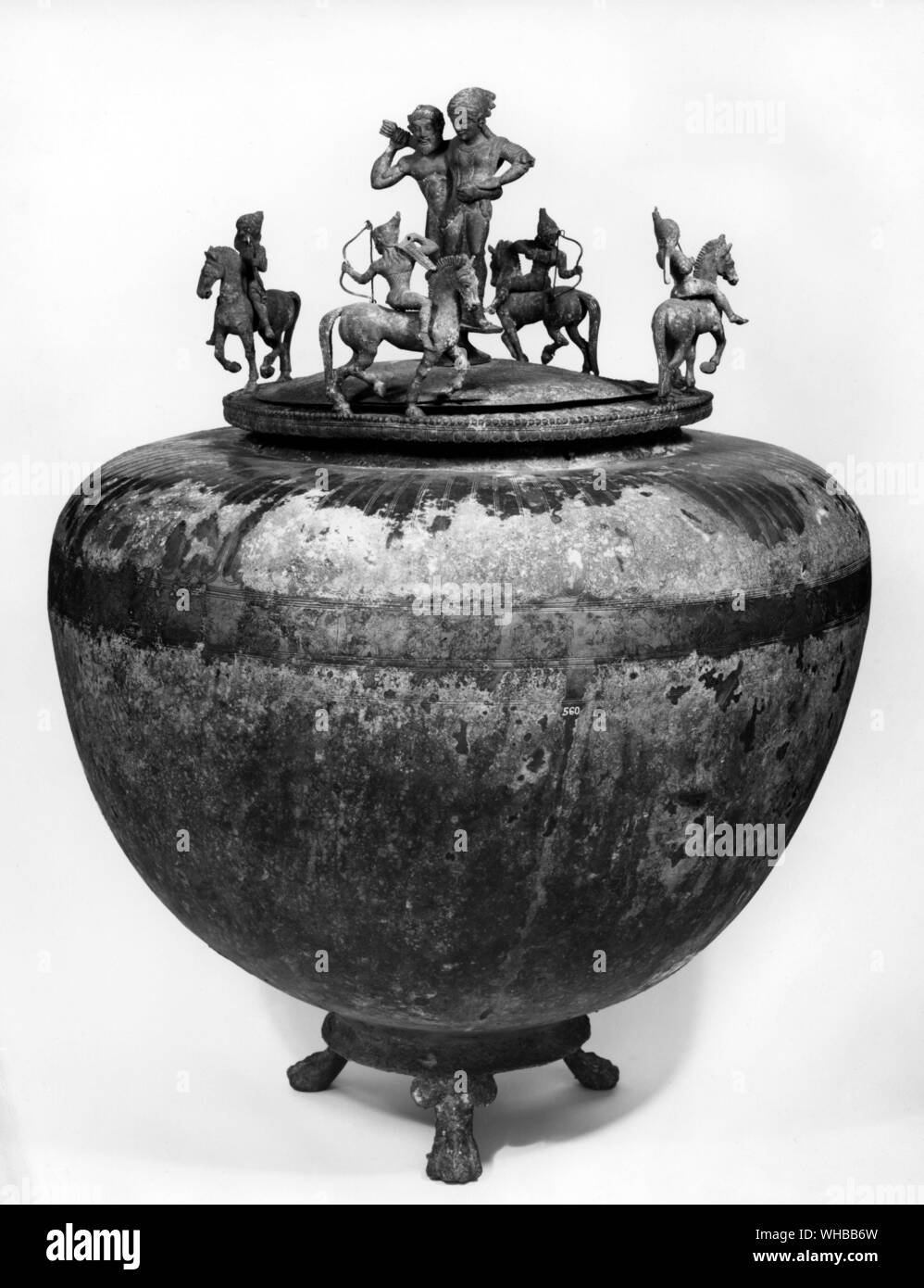 Etruscan bronze pot , Dinos - Salyn , maenad , horsemen . Hercules with woman on shoulder . Driving away oxen of Cacus and with a frieze of animals 500 BC Stock Photo