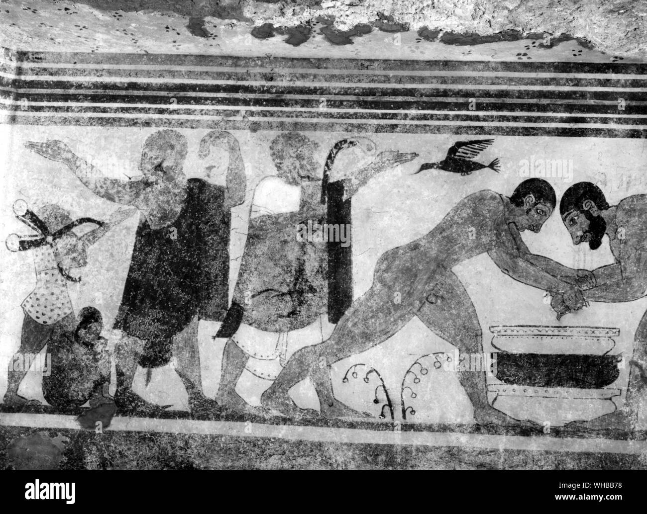 Etrusche tomb with alfresco decoration , Tarquinia outskirts . Depicted are two augurs who interpret the will of the gods by studying the flight of the birds. . Stock Photo