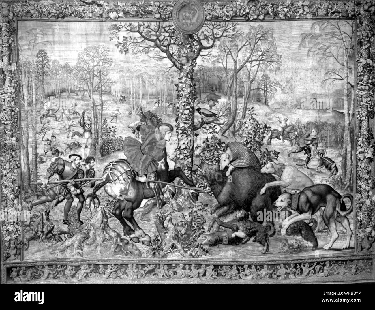 Tapestry showing a hunting scene in December . capricorne hunting the boar from the Maximillian tapestries Stock Photo