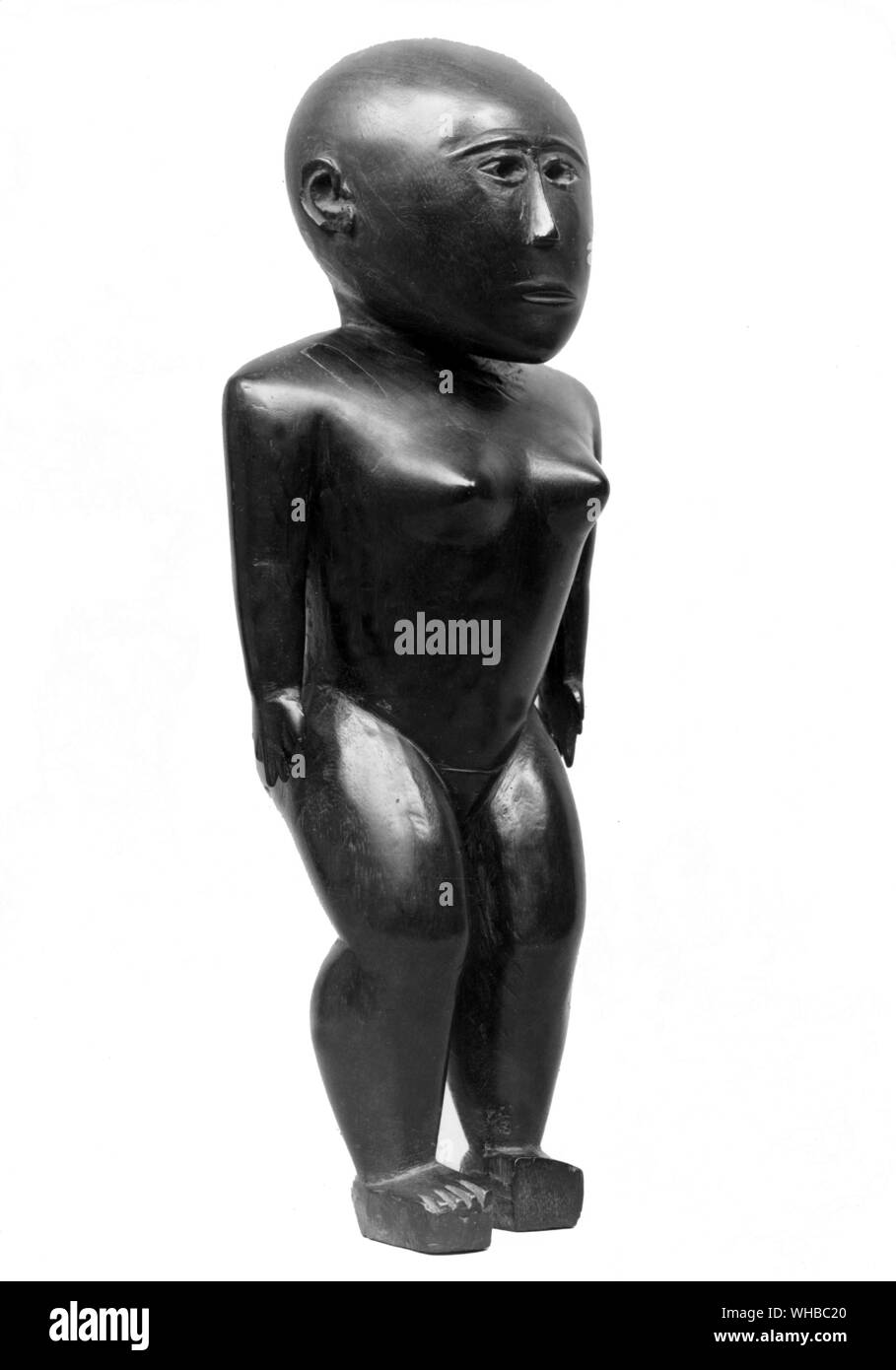 Primitive art - wooden female fiture - Tonga - Said to represent a deity, from Nepal - 15 inches high.. Stock Photo