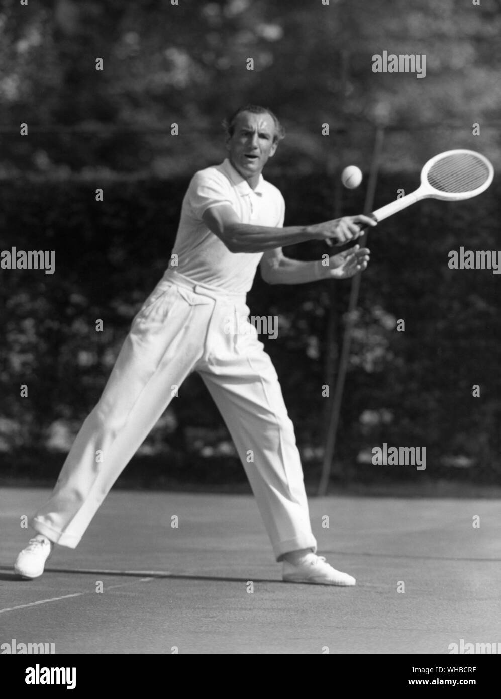 Fred Perry - Frederick John Perry (May 18, 1909 - February 2, 1995) born in Stockport, Cheshire. was an English tennis player and three-time Wimbledon champion. He was the World No. 1 player for five years, four of them consecutive, 1934 through 1938, the first three years as an amateur. He was the last Englishman to win Wimbledon.. Stock Photo