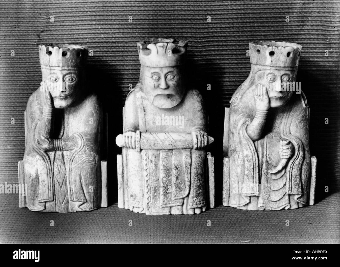 Norse Chessmen : Walrus ivory , a king and two queens c.1200 AD . Discovered  Isle of Lewis , in the Outer Hebrides of Scotland Stock Photo