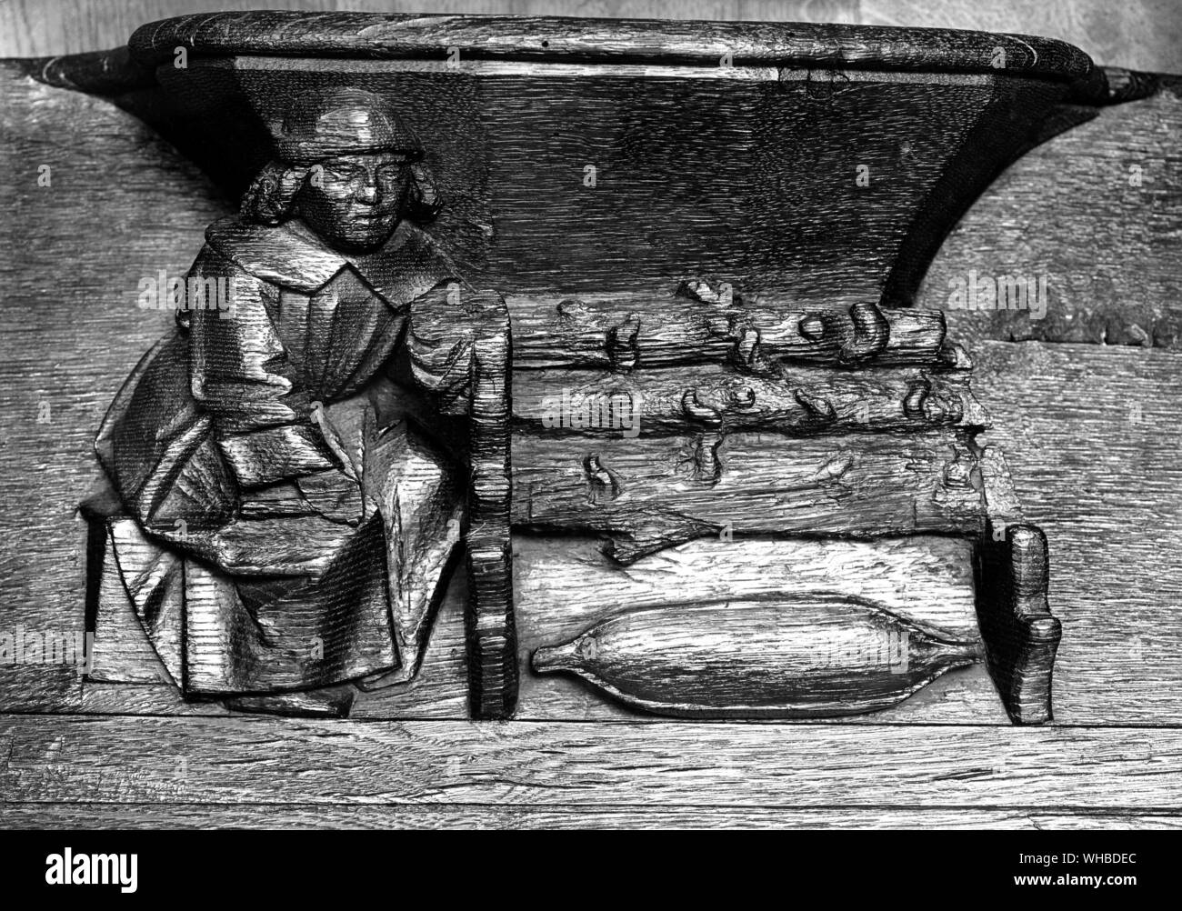 Abbey Saint-Lucien de Beauvais , wooden sculpture of The Rotisseur turning his spit Stock Photo