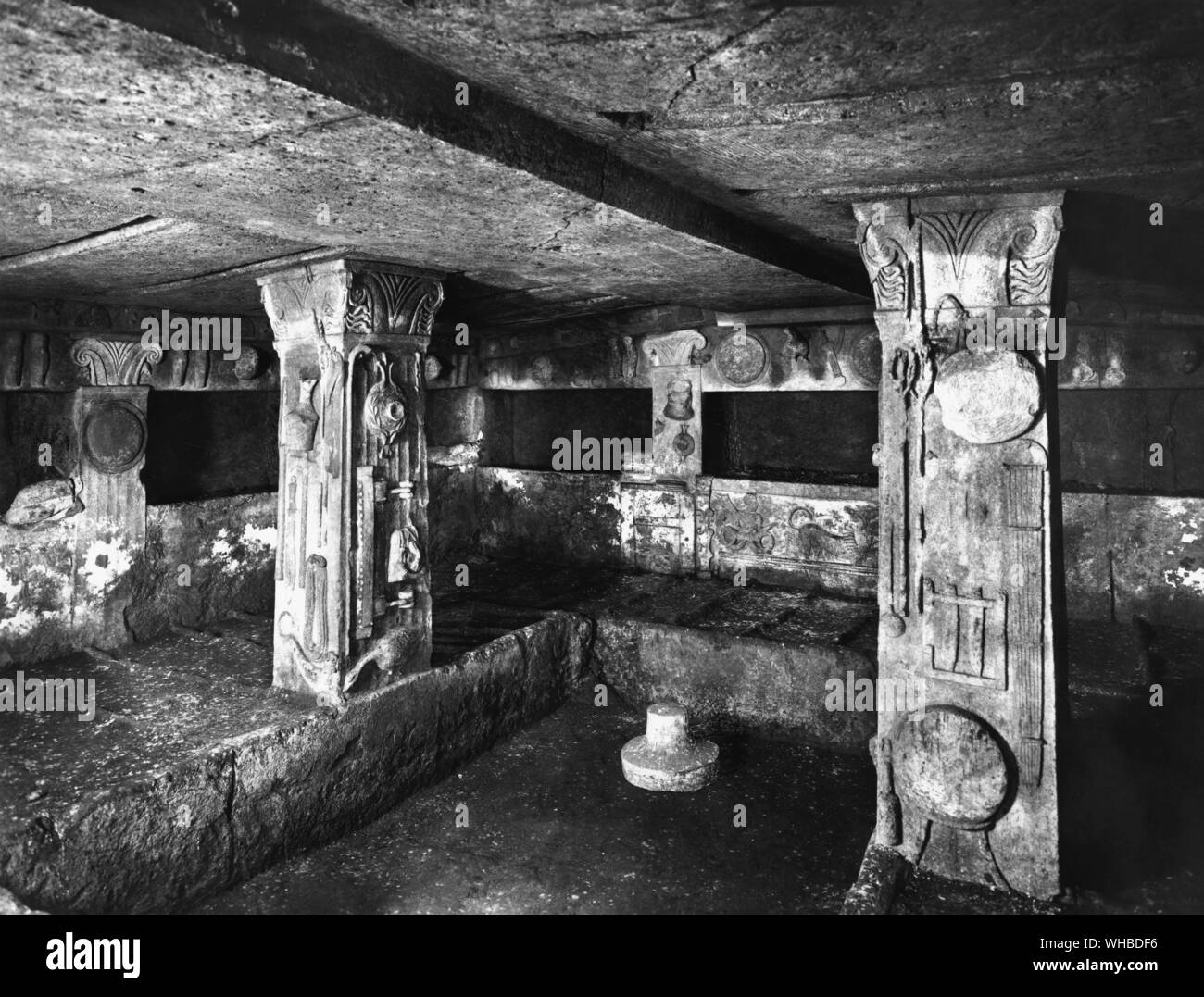 Interior of tomb at Caere , Cerveteri , North Italy : Single chamber with cut out niches and long dromos Stock Photo