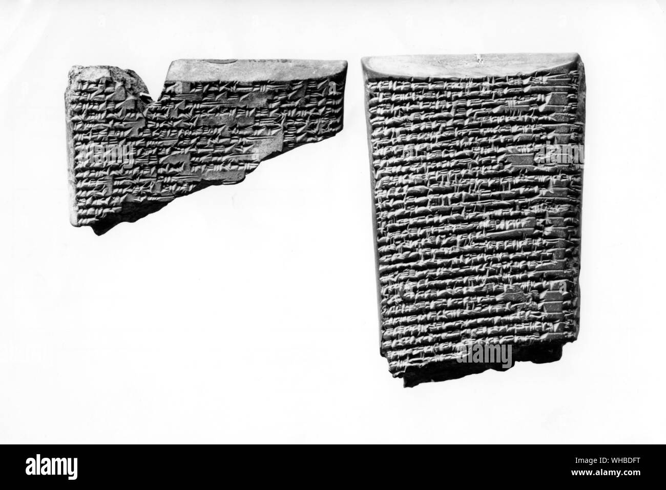 Fragments of baked clay tablet bearing the views and beliefs of the Babylonians and Assyrians about Creation Stock Photo