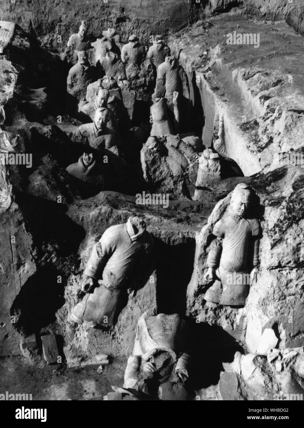 The tomb of Chin Shih Huang , the First Emperor of China . Detailed picture of a corridor in the first pit , at the earliest stage of excavation . The soliders are unarmoured spearmen . Stock Photo
