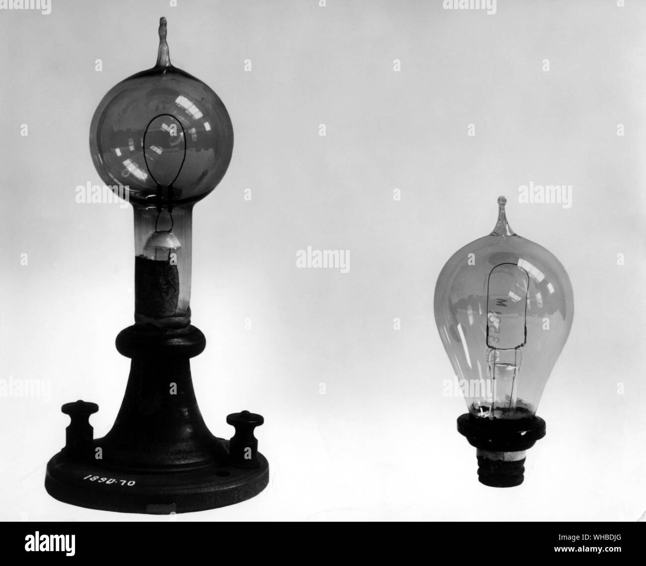 Swan experimental carbon pencil lamp 1878-9 - two early commercial types of lamp c.1880 - Made by the English chemist, Joseph Swan (1827-1914). This lamp is an early carbon and rod filament incandescent electric lamp. . Stock Photo