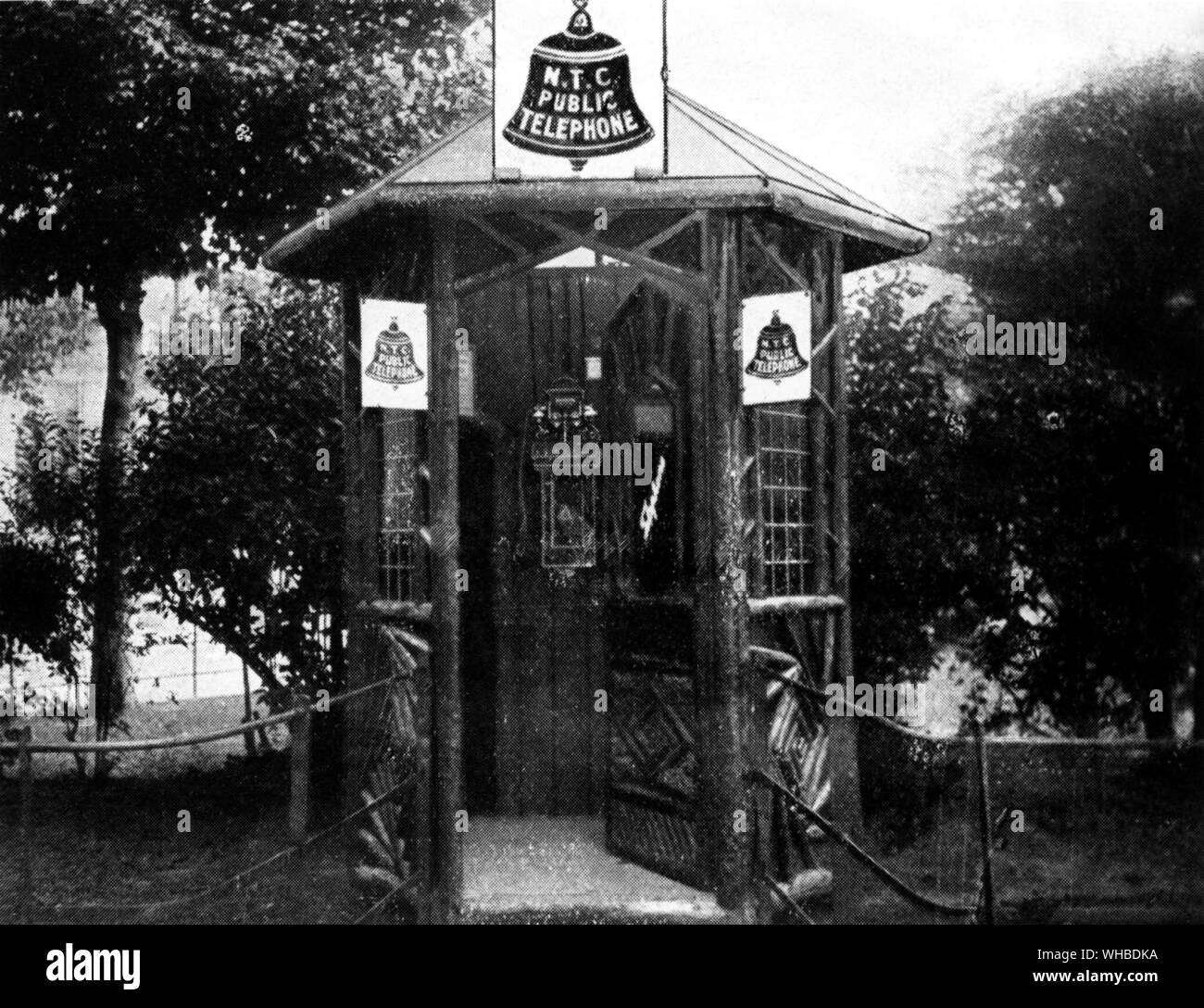 An early National Telephone Co. (NTC) kiosk, designed to blend with its environment - rustic arbour pattern Folkestone 1910. Stock Photo