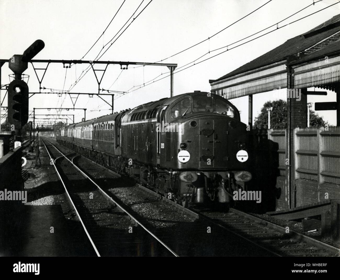 Liverpool Street to Norwich Express, hauled by a new type of Diesel locomotive, made by the English Electric Co., passing through romford Station in Essex. Stock Photo