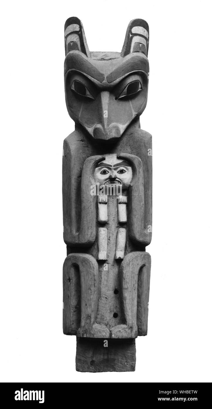 Mouse post of the Bear totem illustrating the myth of the bear and the hunter. It came from the Maida-Tsimshian group of tribes, and was and was sent from British Columbia in 1887. Stock Photo
