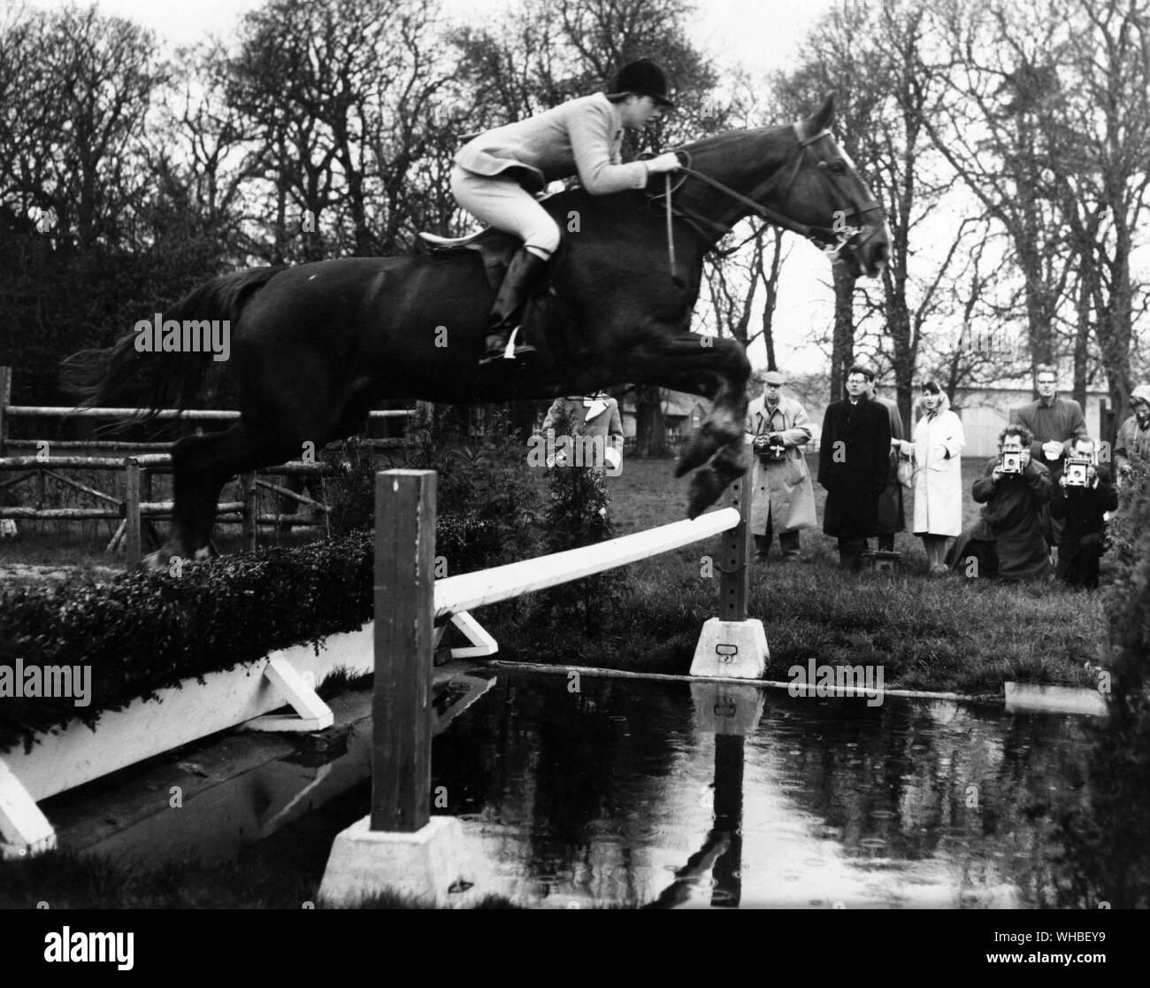 Ann Townsend riding the horse Bandit IV over the Water Jump  whilst training for the Olympics at Arundel 1960 Stock Photo