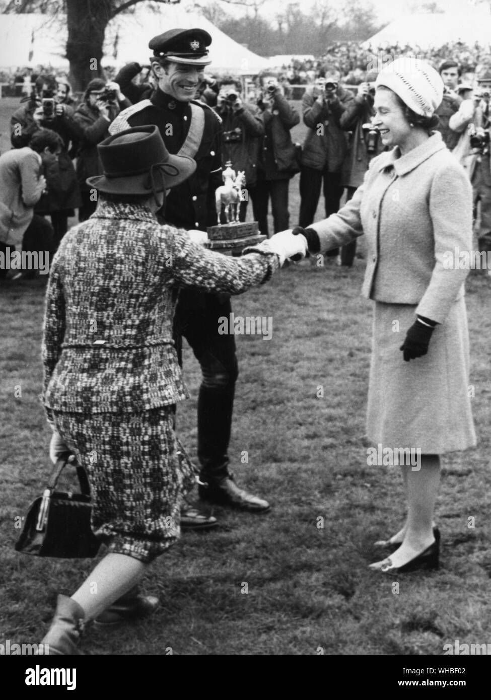 Her Majesty The Queen congratulates Miss Flavia Phillips joint owner of the horse Great Ovation with Mark Phillips after the latter had won the Whitbread Trophy for the second successive year at the 1972 Badminton Horse Trials Stock Photo
