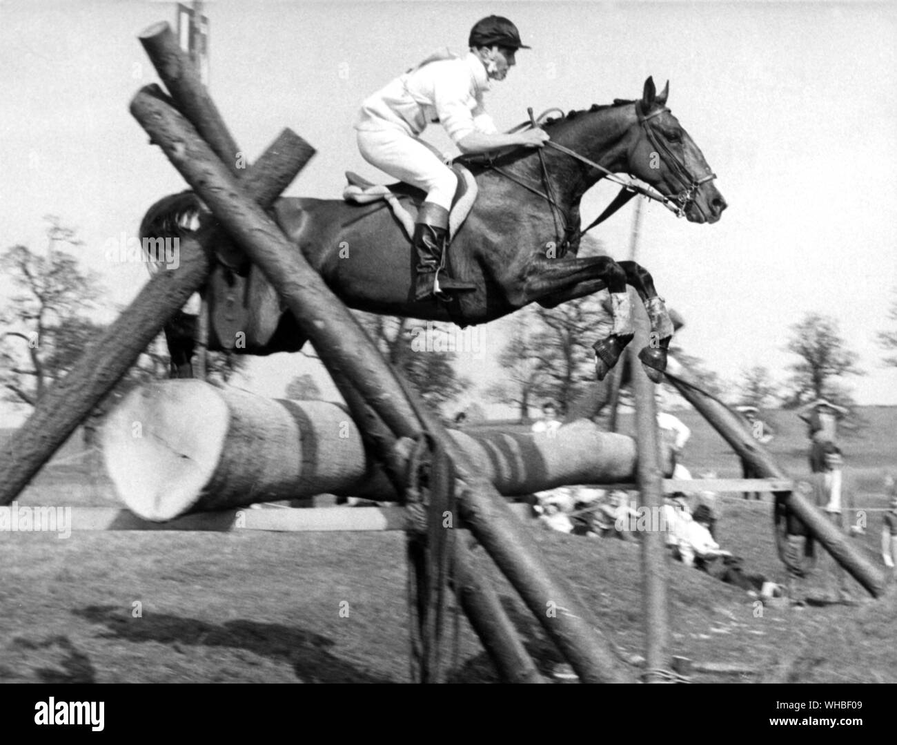 Captain Mark Phillips riding Rock On jumping one of the cross country jumps at the 1968 Badminton Horse Trials Stock Photo