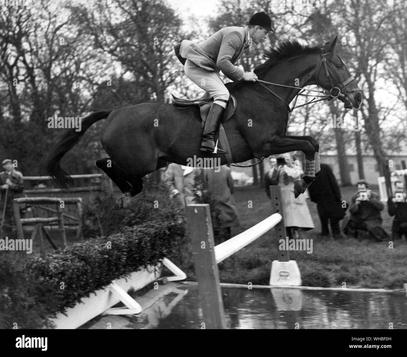 David Barker riding the horse  Franco over the Water Jump  whilst training for the Olympics at Arundel 1960 Stock Photo