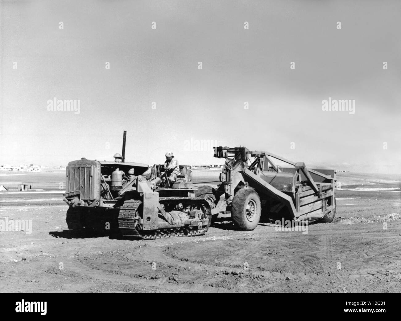 Tractor towing equipment in the desert , Lebanon Stock Photo