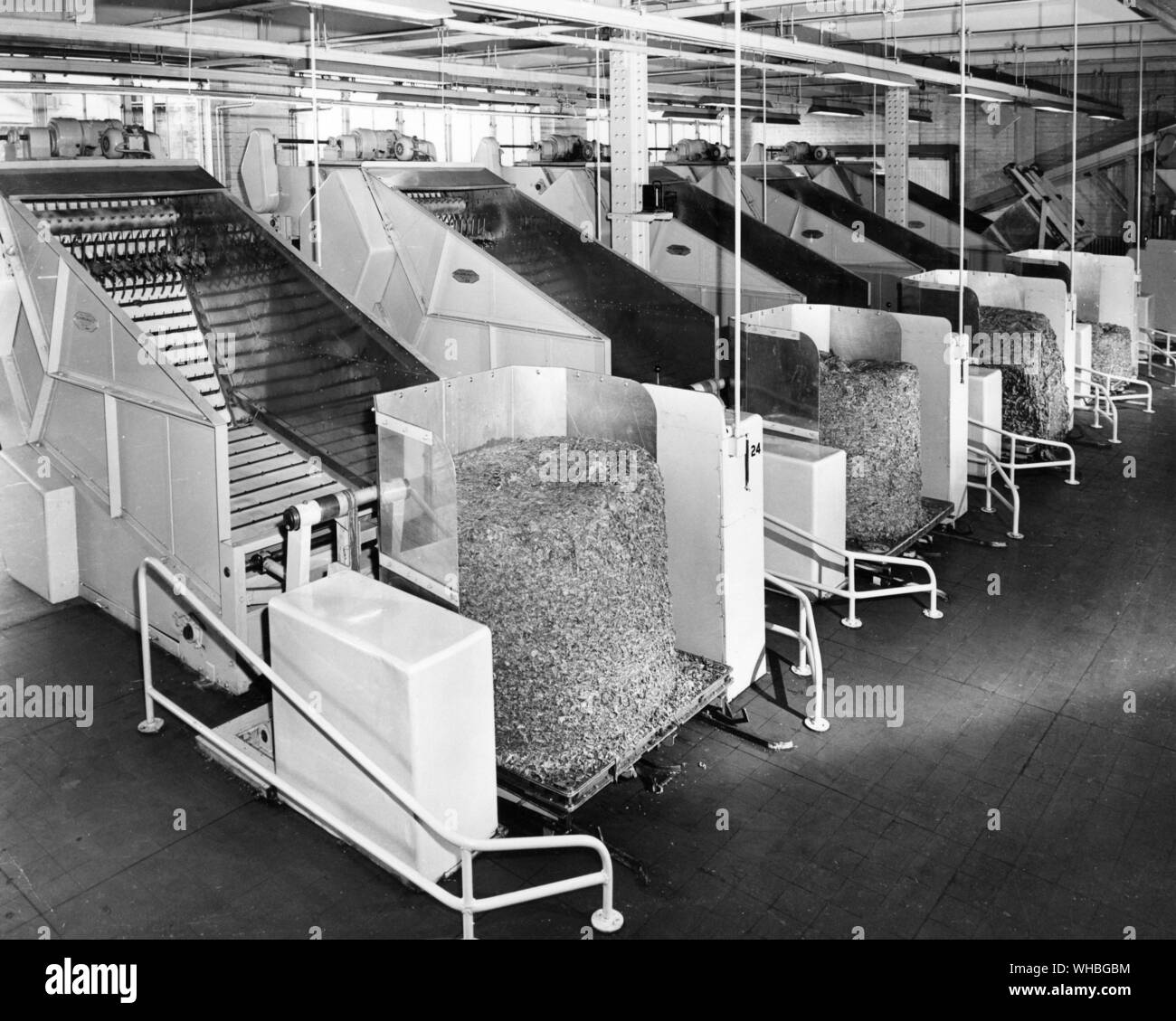 Tobacco production : a group of leaf blending machines in WD & HO Wills Glasgow cigarette factory. 8 January 1965 Stock Photo