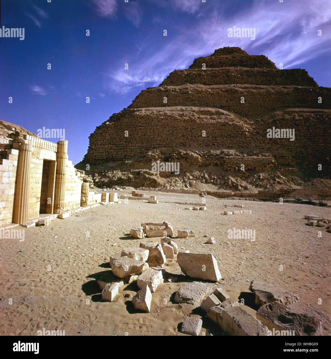 Saqqara - step pyramid - Saqqara, Sakkara, Saqqarah is a vast, ancient burial ground in Egypt, featuring the world's oldest standing step pyramid (29.871264° N 31.216381° E). It is located some 30 km south of modern-day Cairo and covers an area of around 7 km by 1.5 km.. Stock Photo