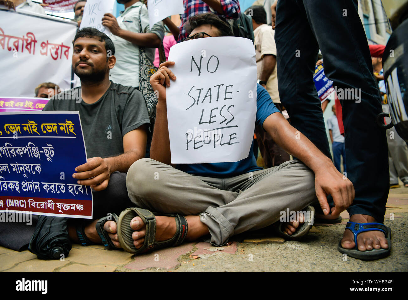 A protester holds a placard that says no stateless people during a protest against National Register of Citizens (NRC) in kolkata.The National Register of Citizens (NRC), is the list of Indian citizens in Assam which is being updated to weed out illegal immigration from Bangladesh and neighbouring regions. Stock Photo