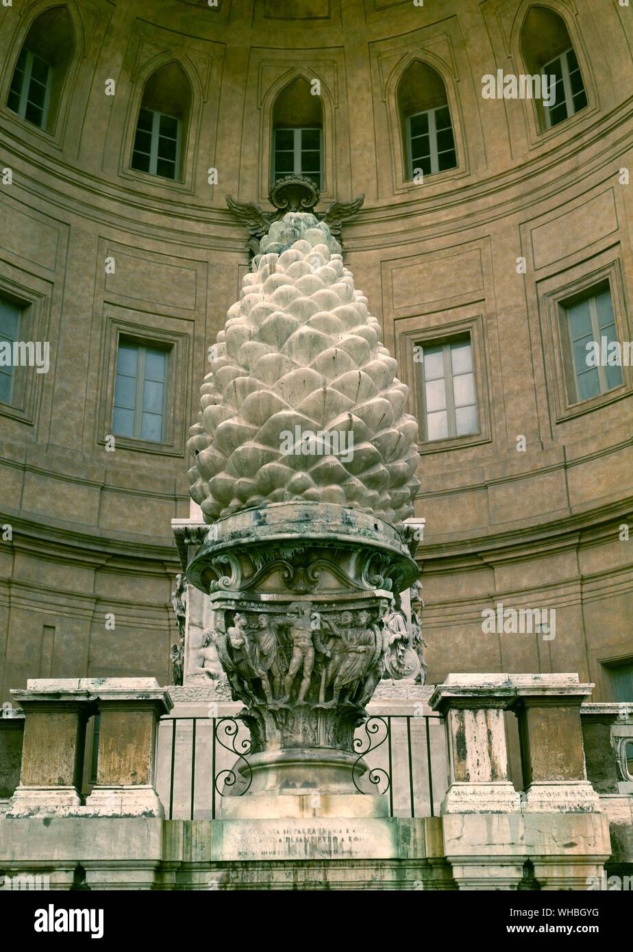 The Pigna fountain at St. Peter's in Rome - Pigna is the name of rione IX of Rome. The name means pine cone in Italian, and the symbol for the rione is the colossal bronze pine cone, the Pigna, which decorated a fountain in Ancient Rome next to a vast Temple of Isis. There water flowed copiously from the top of the pinecone. The Pigna was moved first to the old basilica of St. Peter's, where Dante saw it. In the 15th century it was moved to its current location, the upper end of Bramante's Cortile del Belvedere, which is now usually called in its honour the Cortile della Pigna, linking the Stock Photo