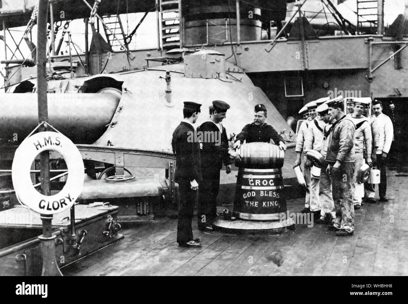 An early twentieth century photograph of the issue of grog aboard HMS Glory Stock Photo