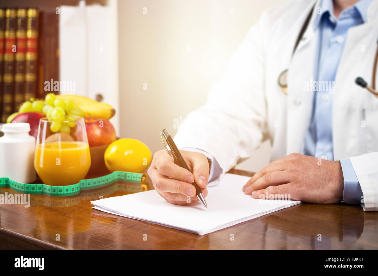 Nutritionist writing diet plan, dietician consultation Stock Photo