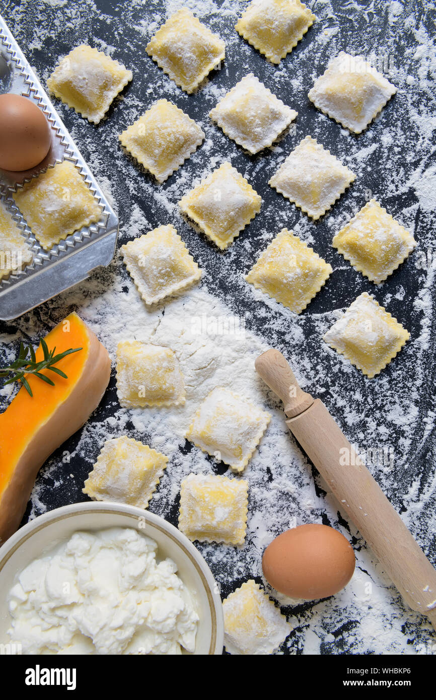 traditional raw ravioli with pumpkin and cottage cheese with flour ...