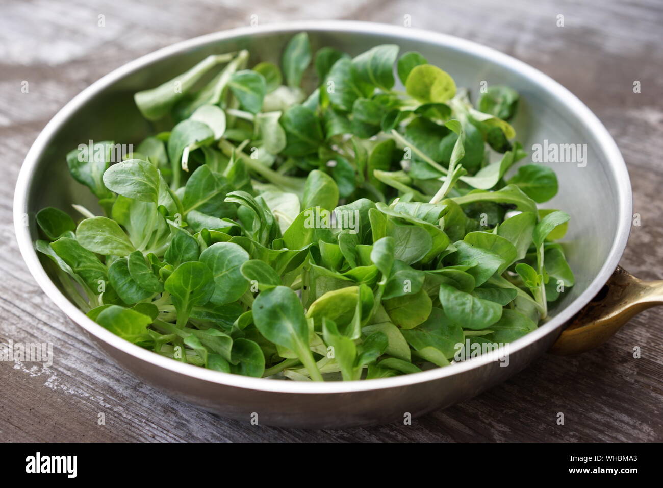 Close-up Of Leaf Vegetable In Container On Table Stock Photo